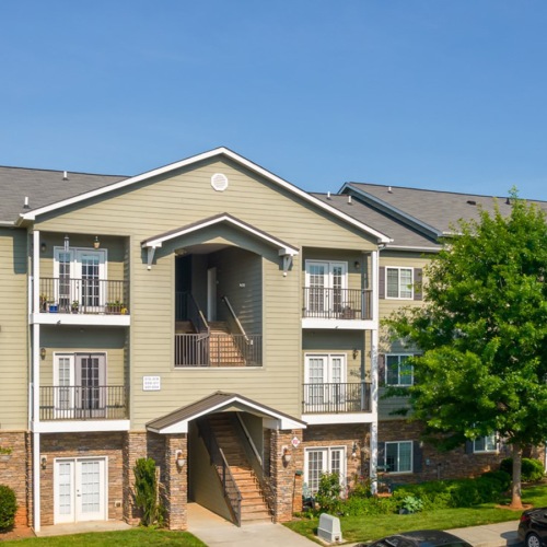 Building Exterior with Stone Building Exterior with Stone at The Pointe at Heritage in Wake Forest, NC
