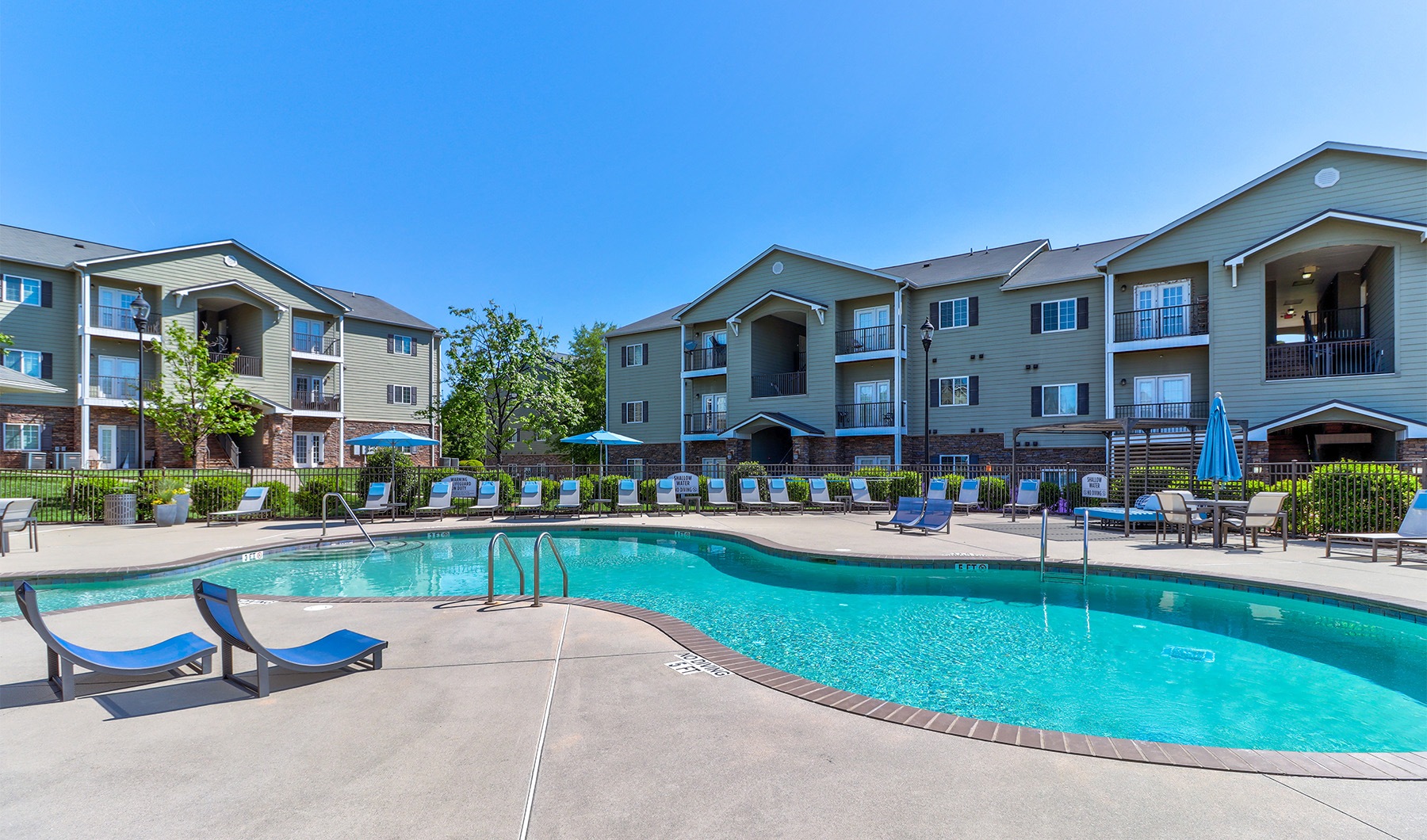 Experience a New Way of Living lounge chairs near outdoor swimming pool