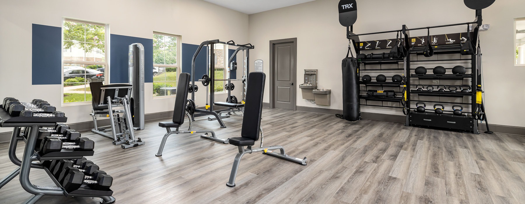spacious fitness center with ample lighting