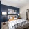 accent wall in bedroom with window